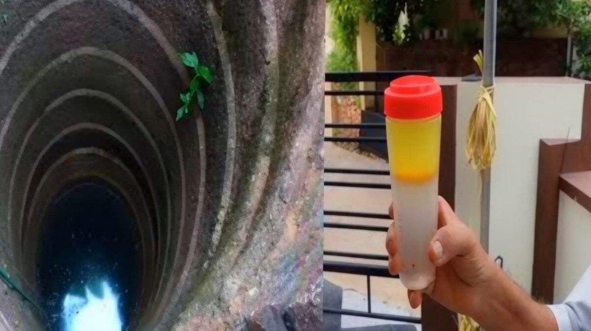A close-up view of a traditional stone well with a visible thick oily fuel layer shimmering on top of the water surface.